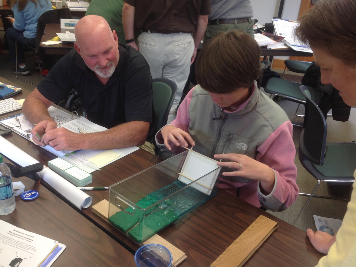 CEETEP participants practice using a tsunami wave tank model.