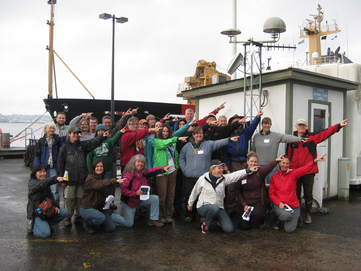 CEETEP participants from October 2013 workshop at GPS station TPW2 (Coast Guard Station, Astoria, Oregon) showing the direction of plate motion relative to stable North American (northeast)