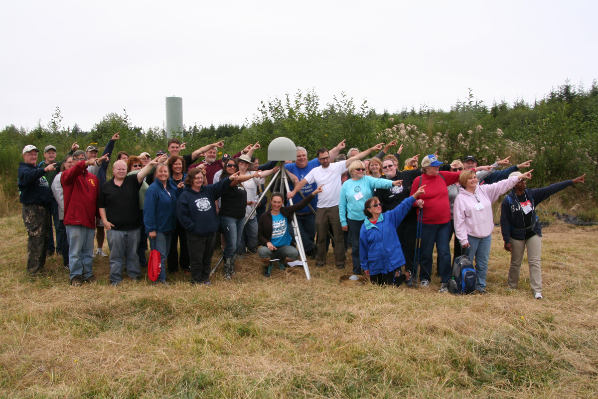 CEETEP participants from August 2014 workshop at GPS station P398 (near Aberdeen, Washington) showing the direction of plate motion relative to stable North American (northeast)